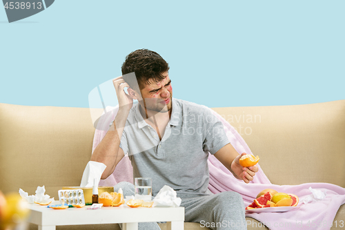 Image of Young man suffering from allergy to citrus fruits