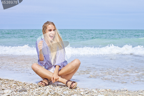 Image of Beautiful happy girl on the Adriatic beach. Travel and vacation.