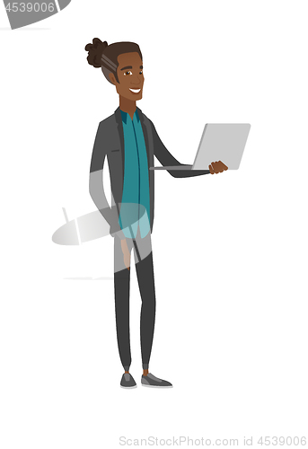 Image of Young african-american man using a laptop.