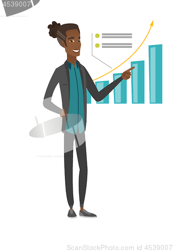 Image of Young african businessman pointing at chart.