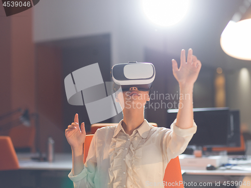 Image of businesswoman using VR-headset glasses of virtual reality
