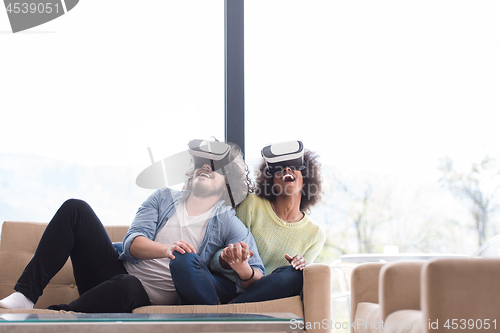 Image of Multiethnic Couple using virtual reality headset