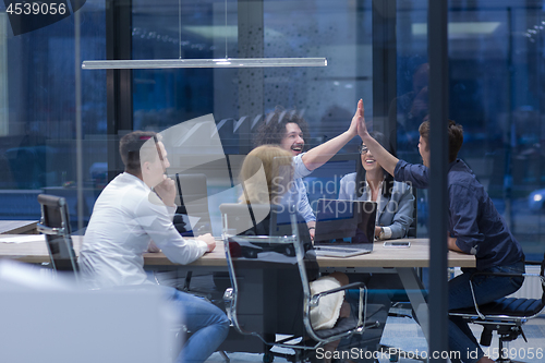 Image of startup Group of young business people celebrating success