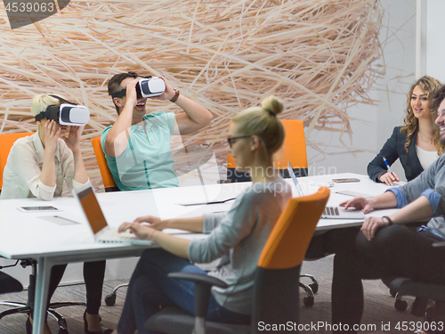 Image of startup business team using virtual reality headset