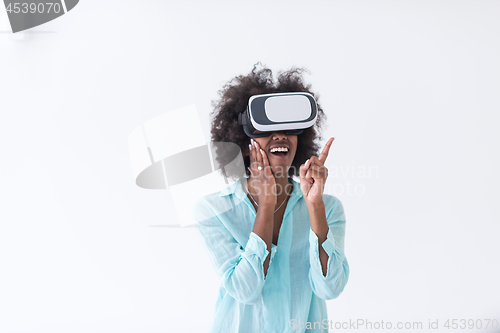 Image of black girl using VR headset glasses of virtual reality