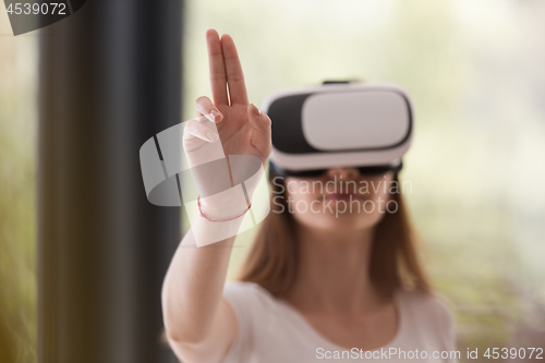 Image of woman using VR-headset glasses of virtual reality