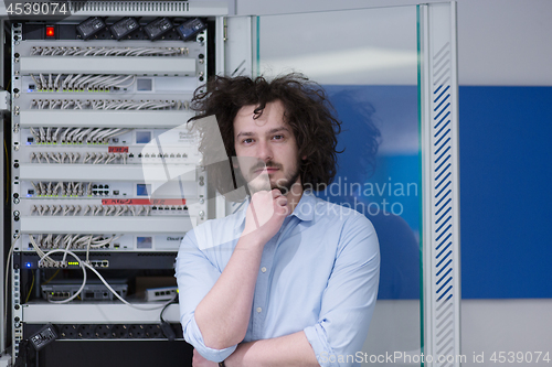 Image of business man engeneer in datacenter server room