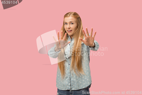 Image of Let me think. Doubtful pensive woman with thoughtful expression making choice against pink background