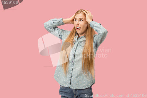 Image of Beautiful woman looking suprised isolated on pink