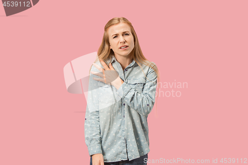 Image of Young woman overwhelmed with a pain in the shoulder