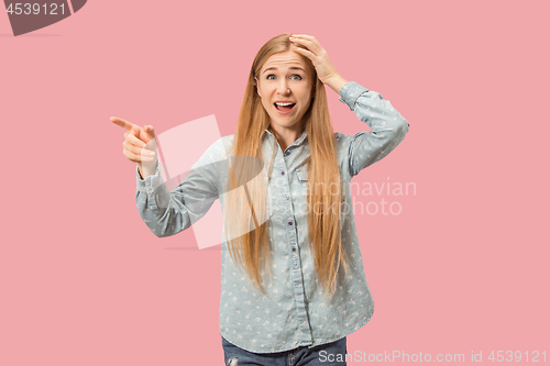 Image of Beautiful woman looking suprised isolated on pink