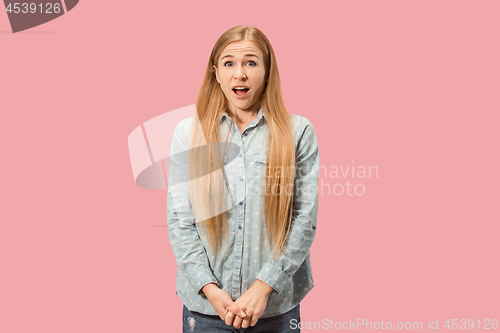 Image of Beautiful woman looking suprised isolated on pink