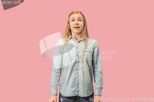 Image of Beautiful woman looking suprised isolated on pink