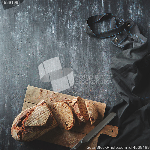 Image of Sliced bread on wooden board