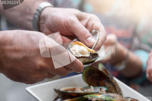 Image of Eating mussel in New Zealand