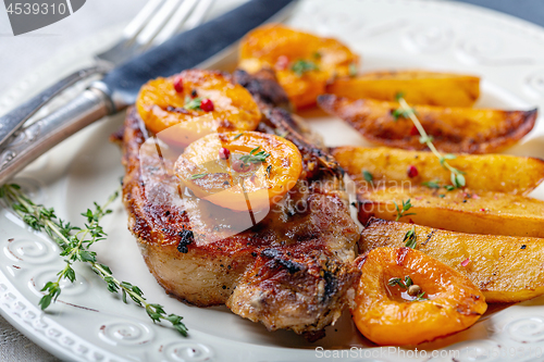 Image of Pork entrecote with apricots, thyme and potatoes.