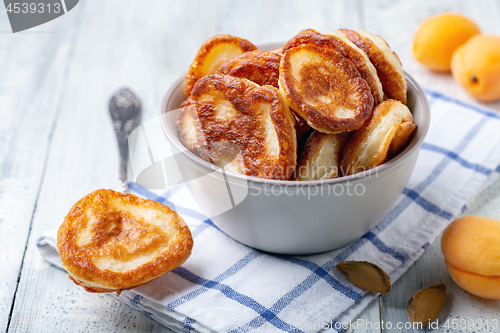 Image of Homemade pancakes in a clay bowl.