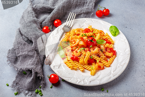 Image of Pasta with shrimp in tomato sauce.