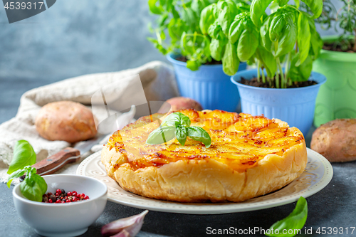 Image of Homemade Tarte Tatin with potatoes.