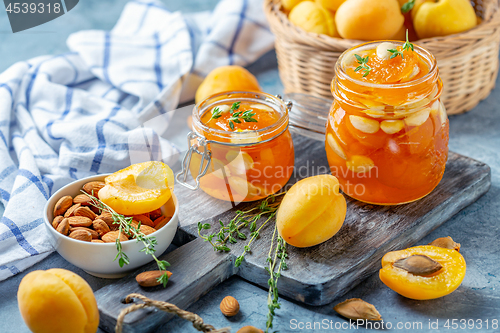 Image of Homemade apricot jam with thyme and sweet almonds.