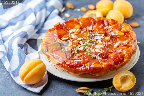 Image of Apricot tarte tatin pie with thyme and almonds.