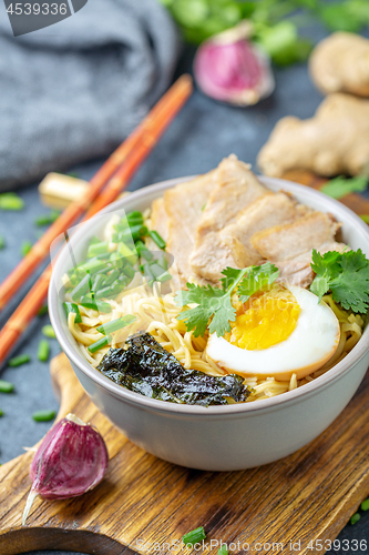 Image of Ramen noodles with pork and pickled egg.