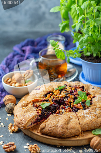 Image of Galette pie with black currant for breakfast.