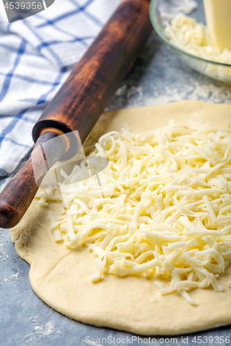 Image of Preparation of traditional pie with cheese.