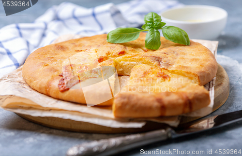 Image of Closed cheese pie (khachapuri) close-up.