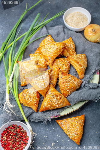 Image of Small pies with meat samosa - oriental cuisine.