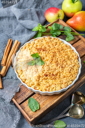 Image of Homemade apple crumble with cinnamon.