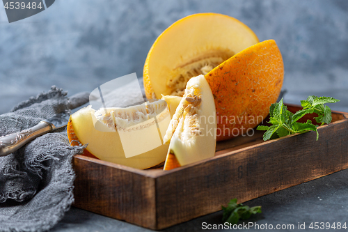 Image of Slices of ripe yellow melon.