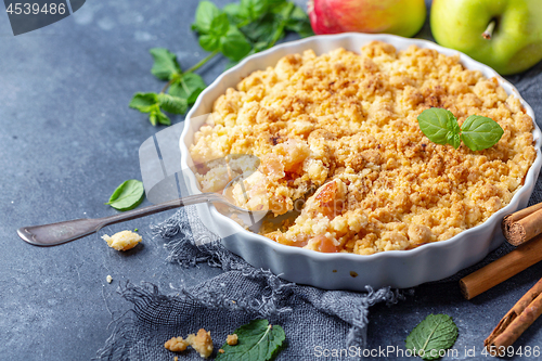 Image of Homemade apple crumble with cinnamon.