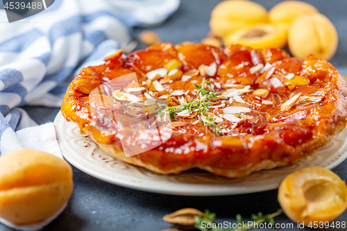 Image of Apricot and almond tarte tatin on a white plate.