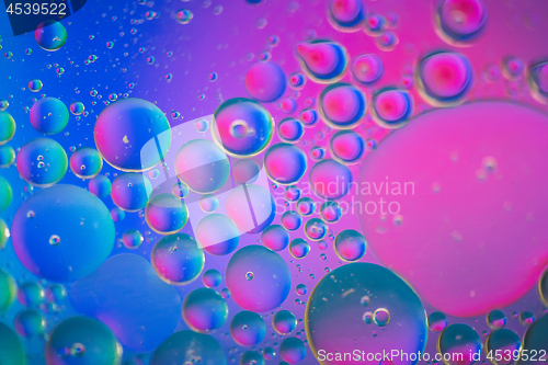 Image of Defocused pink and blue abstract background picture made with oil, water and soap