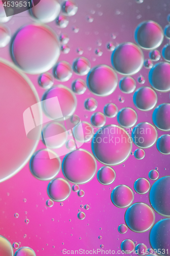 Image of Purple defocused abstract background picture made with oil, water and soap