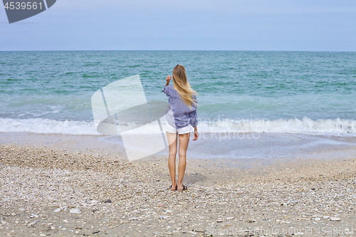 Image of Beautiful girl in sea style on the Adriatic beach. Travel and va