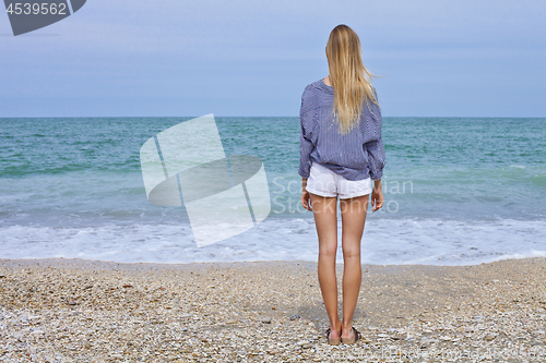 Image of Beautiful girl in sea style on the Adriatic beach. Travel and va