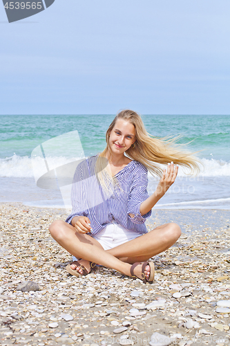 Image of Beautiful happy girl on the Adriatic beach. Travel and vacation.