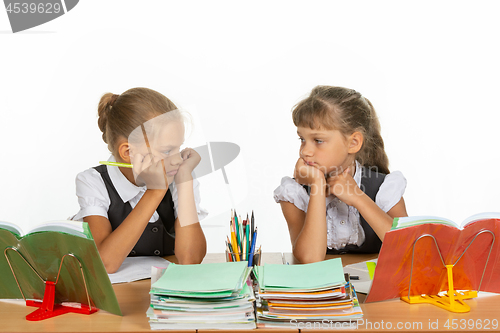 Image of Sad schoolgirls in class received a deuce, and looked at each other