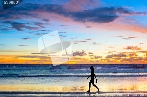 Image of Walking  at sunset. Bali island