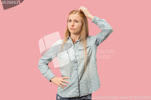 Image of Young serious thoughtful business woman. Doubt concept.