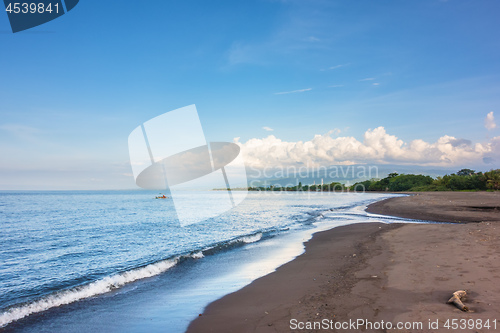 Image of a dark sand beach in northern Bali Indonesia