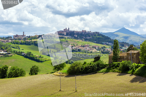 Image of Camerino in Italy Marche over colourful fields