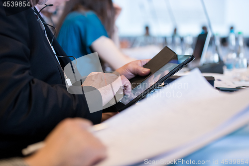 Image of close up of business people hands using tablet computer