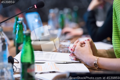 Image of close up of business people taking notes