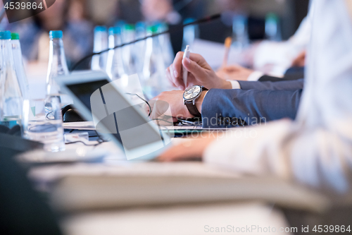 Image of close up of business people hands using laptop computer