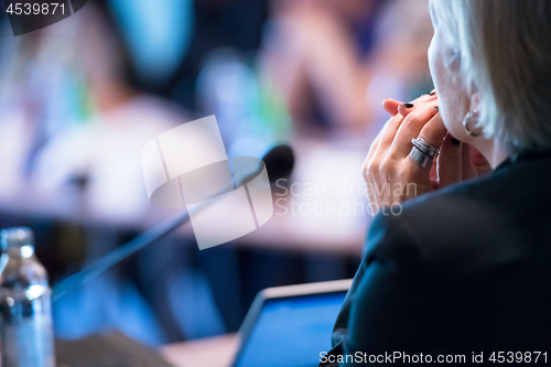 Image of close up of businesswoman giving presentations at conference roo