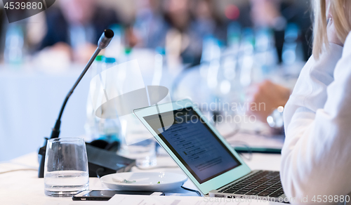 Image of close up of business people hands using laptop computer