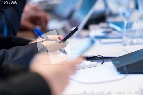 Image of business people hands using smart phone